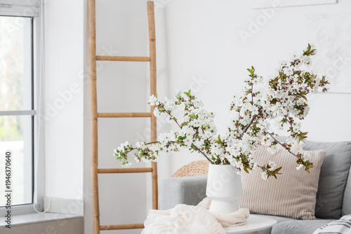 Vase with flowering branche...
