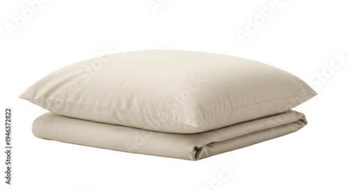 Neutral beige pillow and folded duvet cover create a calm and inviting bedroom aesthetic on white backdrop