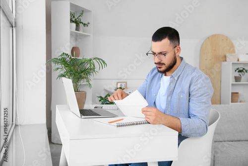 Young man with refund form ...