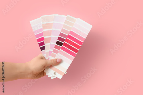 Female hand with pink color...