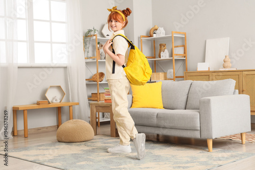 Teenage redhead girl with b...