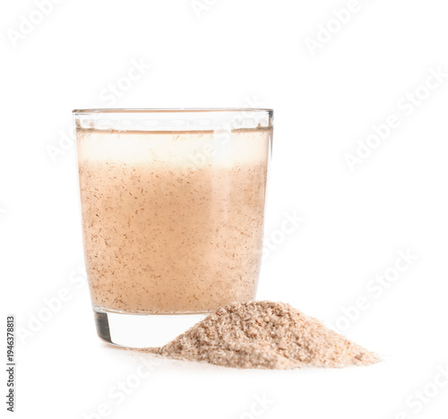 Glass of water with psyllium husk powder on white background