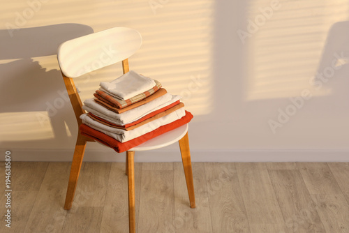 Chair with stack of clean b...