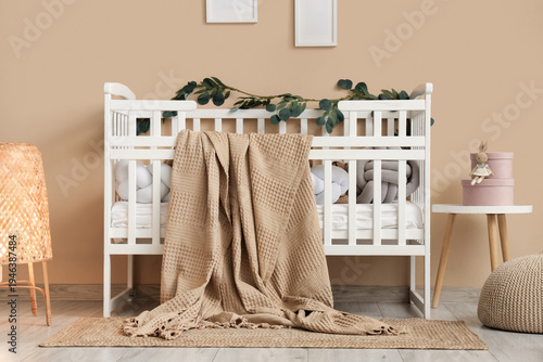 Stylish white crib with pla...