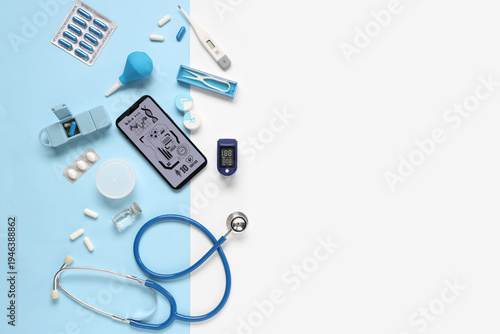 Mobile phone with medical supplies on blue and white background. Telemedicine...