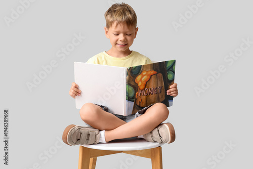Cute little boy sitting on ...