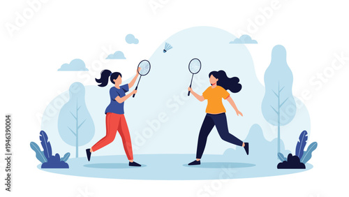 Two active women enjoy a friendly game of badminton in a beautiful outdoor park setting, showcasing a healthy and energetic lifestyle through sports.