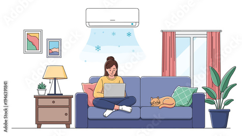 Young woman sitting on a blue sofa and working on a laptop while the air conditioner blows cool air into her modern living room.