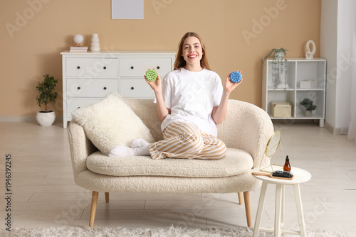 Smiling young woman sitting...