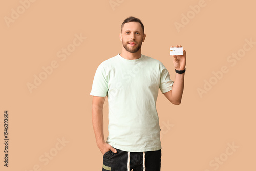 Stylish young man showing c...