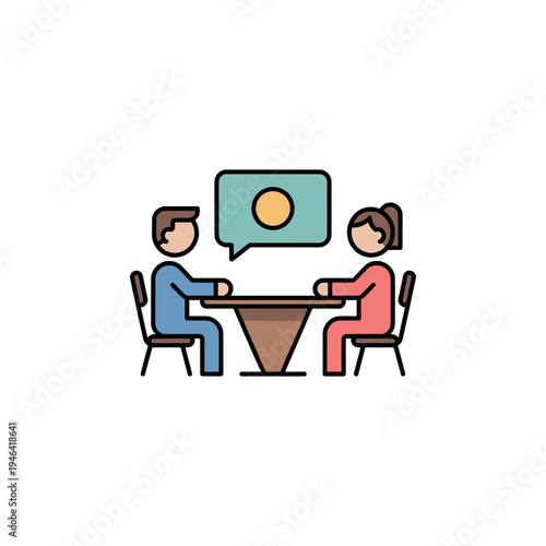 Two people sitting at a table having a discussion or meeting