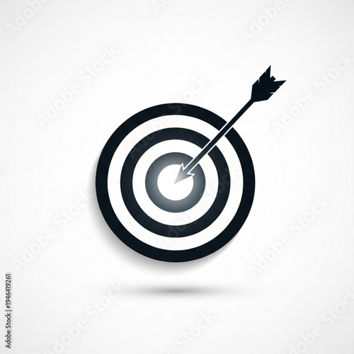 Black and gray target with arrow hitting bullseye