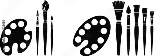 Black and white of two paint palettes and six paintbrushes arranged in a row tools