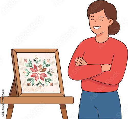 Woman displays her needlework art on an easel with pride indoors.