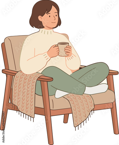 Woman sits relaxed in chair holding cup wearing sweater and jeans indoors