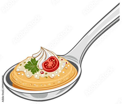 Spoonful of savory cream soup with fresh tomato and parsley garnish