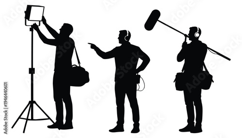 Three film crew members working together on a movie set