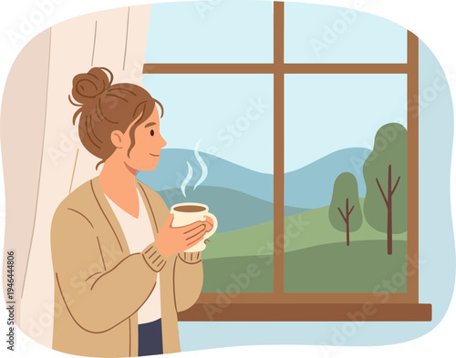 Woman enjoys hot coffee while looking out the window at scenic mountains and trees