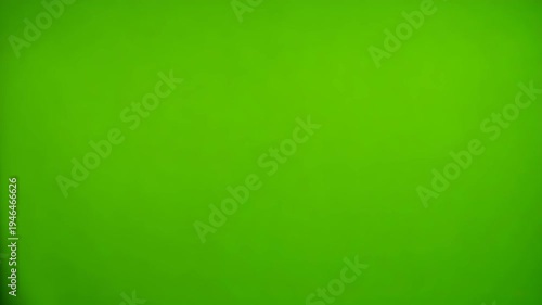Red Gift Wrap Tearing Away to Reveal Vibrant Green Screen