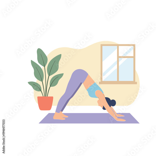 A woman practices downward-facing dog yoga pose on a mat indoors.
