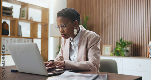 Photos Black woman, laptop and typing in office for lawsuit research, case preparation and drafting legal report