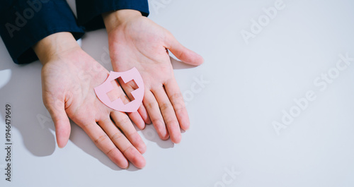 Healthcare concept. Healthcare protection safety hands shield medical symbol pink human white person palm gesture care prevention security wellness clean