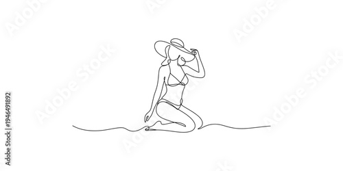 Woman in a bikini and sunhat sitting on the beach line drawing continuous one kneeled