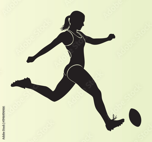 Female athlete kicking a ball in dynamic action pose