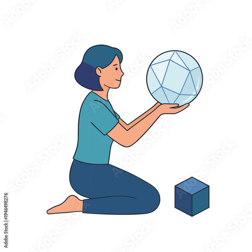 Woman kneeling indoors holding a geometric sphere and a cube.