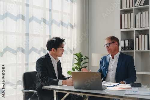 Canvas Print Businessmen discussing strategy during a corporate meeting