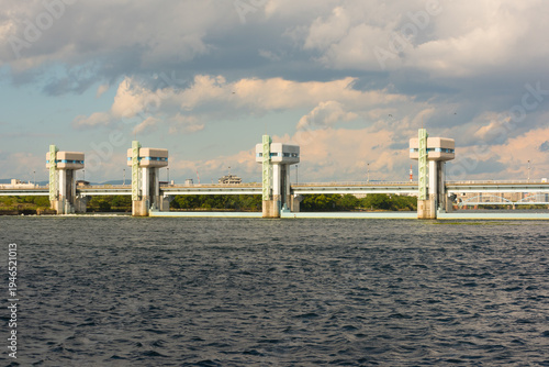 Wallpaper Mural river water control gate structure under a cloudy sky Torontodigital.ca
