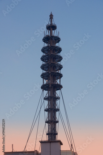 Wallpaper Mural Silhouette of a tall communication tower against a clear dusk sky at sunset Torontodigital.ca