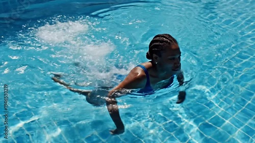 Woman Exercising in Swimming Pool
