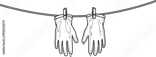 A pair of gloves hanging on a clothesline with clips