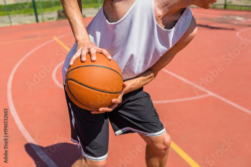 Young man playing basketball