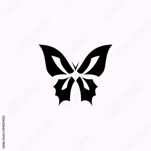 Vector illustration of a black geometric butterfly with a flat design. A symmetrical abstract butterfly isolated on a light background