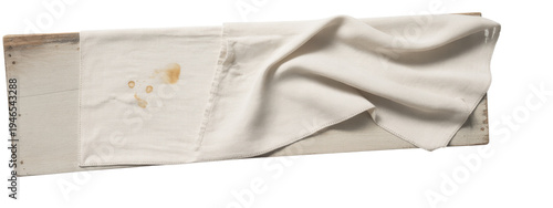 stained napkin on rustic wooden surface.