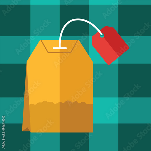 Tea Bag Delight: An elegant tea bag with red label, ready to steep, against a backdrop of plaid pattern, perfect for a cozy afternoon or tea break.