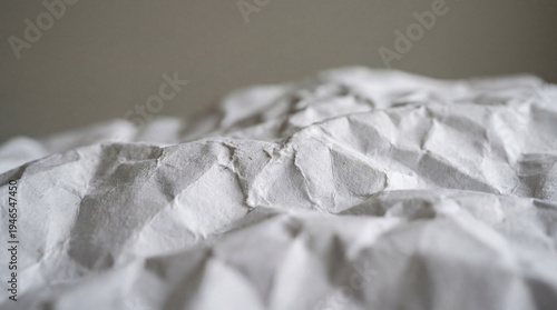 a highly detailed full-frame shot of a crumpled sheet of white paper