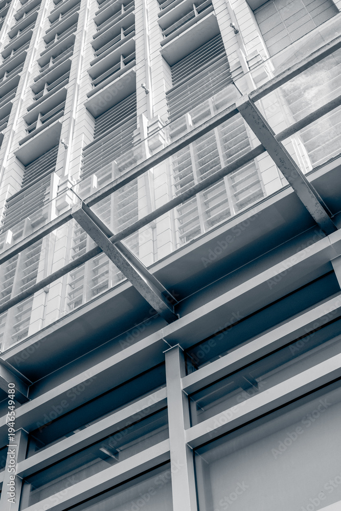 Obraz premium Modern building facade viewed from low angled exterior