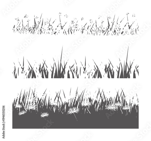 Dark gray grass borders with small flowers and sparse tufts silhouette