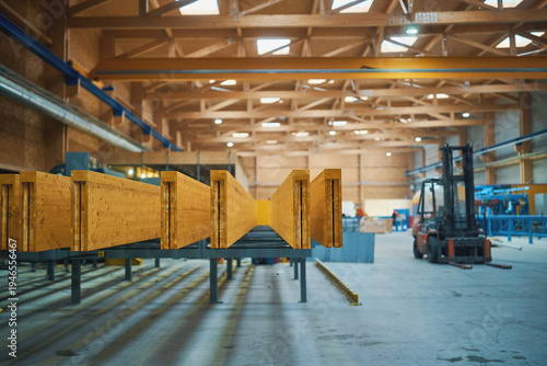 Laminated timber beams in industrial factory with forklift