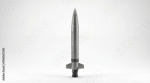 Technological Ascent: A sleek, metallic rocket poised for launch, symbolizing innovation and the pursuit of progress. The stark design enhances the sense of power and forward momentum.