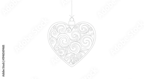 Beautiful heart shaped ornament with swirling patterns hanging from a string