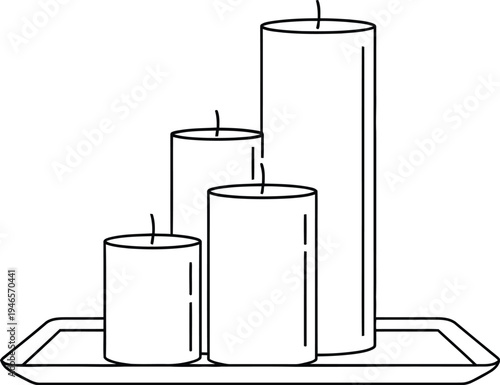Three cylindrical candles on a tray in different sizes
