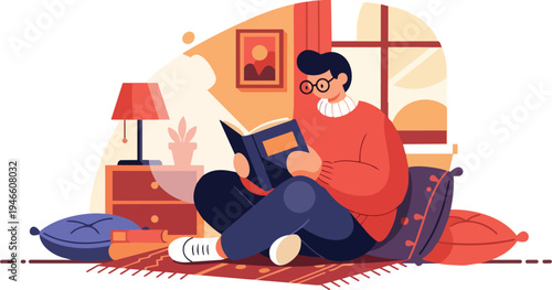 Young man sitting on pillows on the floor, reading a book in a cozy room with a lamp and window