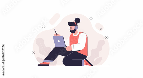 A person with headphones and glasses sits on the floor with a laptop