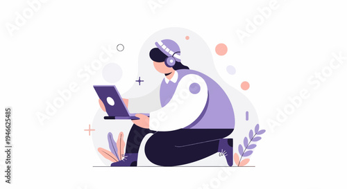 A person wearing headphones crouches while using a laptop