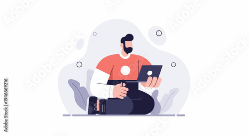 Bearded man in casual attire working on a laptop computer