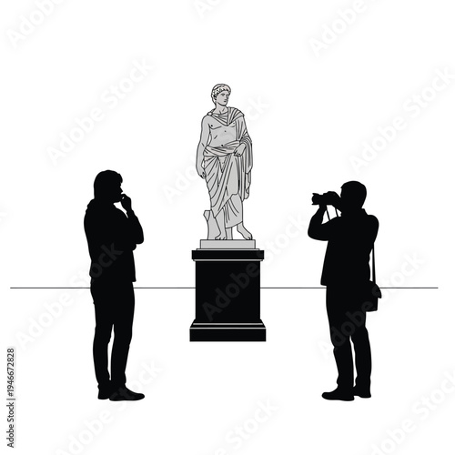Two people looking at and photographing a statue in a museum or gallery setting